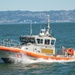 Coast Guard Bay Area assets pose for group photo with a 9/11 commemorative flag