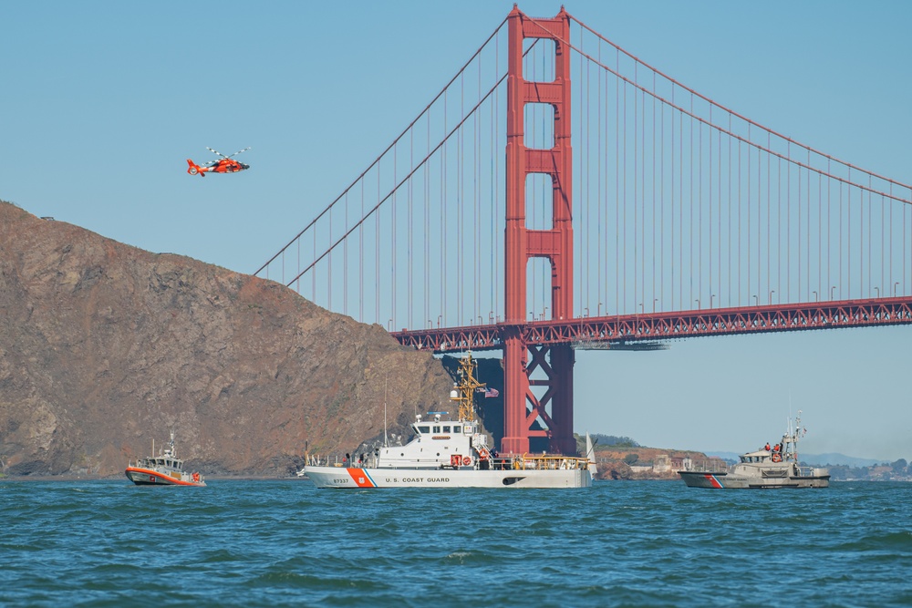 Coast Guard Bay Area assets pose for group photo with a 9/11 commemorative flag