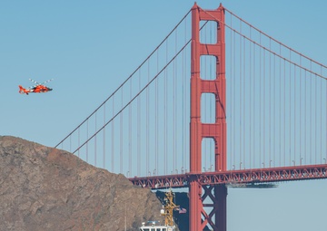 Coast Guard Bay Area assets pose for group photo with a 9/11 commemorative flag