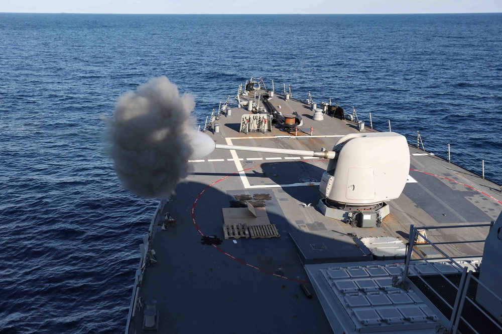 USS Ross fires its 5-inch gun