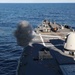 USS Ross fires its 5-inch gun