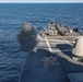 USS Ross fires its 5-inch gun