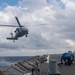 An MH-60S Sea Hawk helicopter, assigned to the “Dragonslayers” of Helicopter Sea Combat Squadron (HSC) 11, comes in for a landing