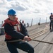 Fire Controlman (AEGIS) 3rd Class Joshua Chadwick, from Corpus Christi, Texas, heaves around on line