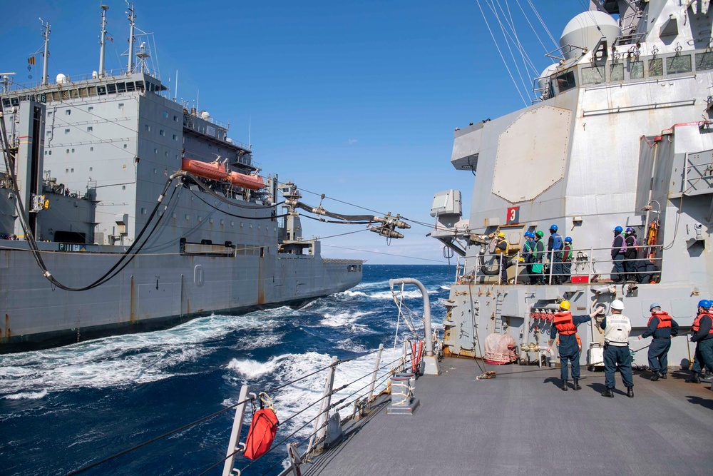 The USNS Robert E. Peary (T-AKE 5) and USS Gonzalez (DDG 66) conduct a replenishment-at-sea