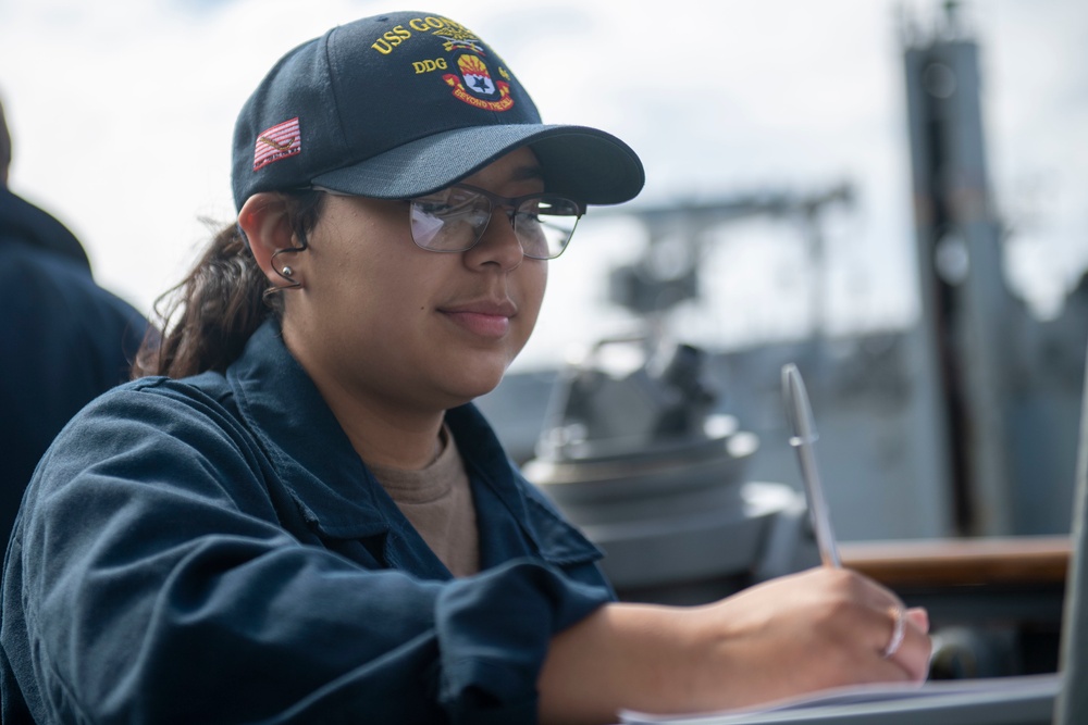 Quartermaster Seaman Apprentice Isabella Anaya, from Aurora, Colo., records how many pallets are received in the deck log