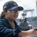 Quartermaster Seaman Apprentice Isabella Anaya, from Aurora, Colo., records how many pallets are received in the deck log