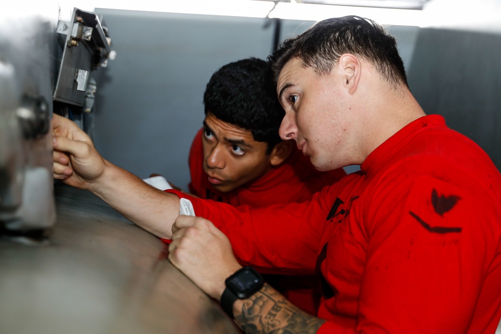 Abraham Lincoln Sailors conduct aircraft maintenance