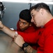 Abraham Lincoln Sailors conduct aircraft maintenance