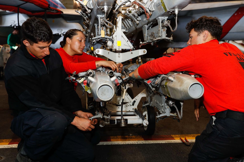 Abraham Lincoln Sailors conduct aircraft maintenance