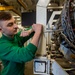 Sailor Works On Engine