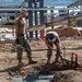 US Navy Seabees with NMCB-5 place concrete footers onboard Naval Base Ventura County