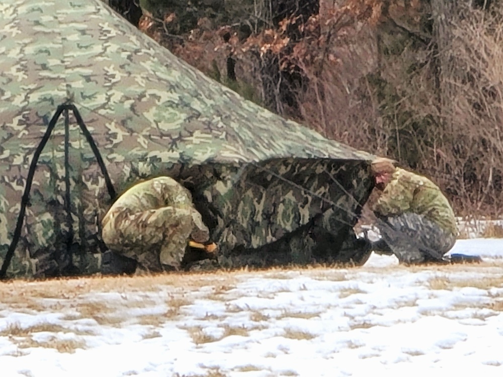 Soldiers, Airmen learn to build Arctic tents during CWOC training at Fort McCoy