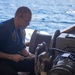 Sailor Repairs Replenishment-At-Sea Equipment