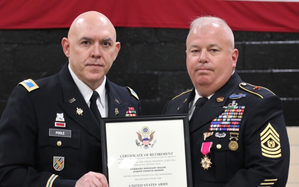 Two U.S. Army soldiers in dress uniforms are posing together while holding a framed Certificate of Retirement. The certificate is issued to Command Sergeant Major Joseph Francis Shirer, retired from the United States Army on July 1, 2022. The officer on the left, identified by his name tape as 'POOLE,' appears to be presenting the retirement certificate.
