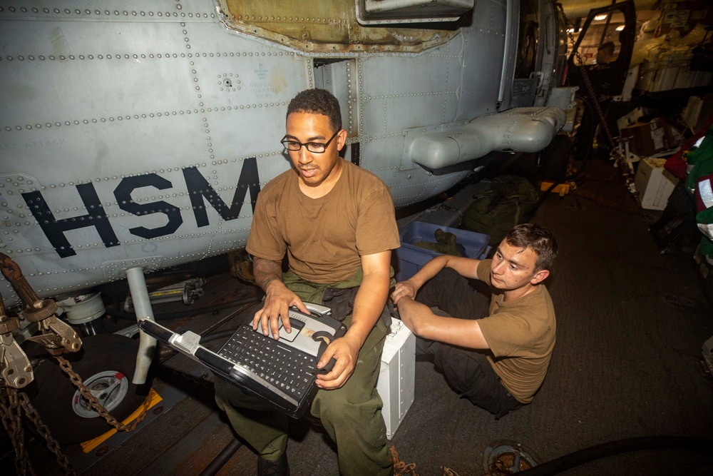 Sailors Aboard USS Ralph Johnson (DDG 114) Conduct Aircraft Maintenance