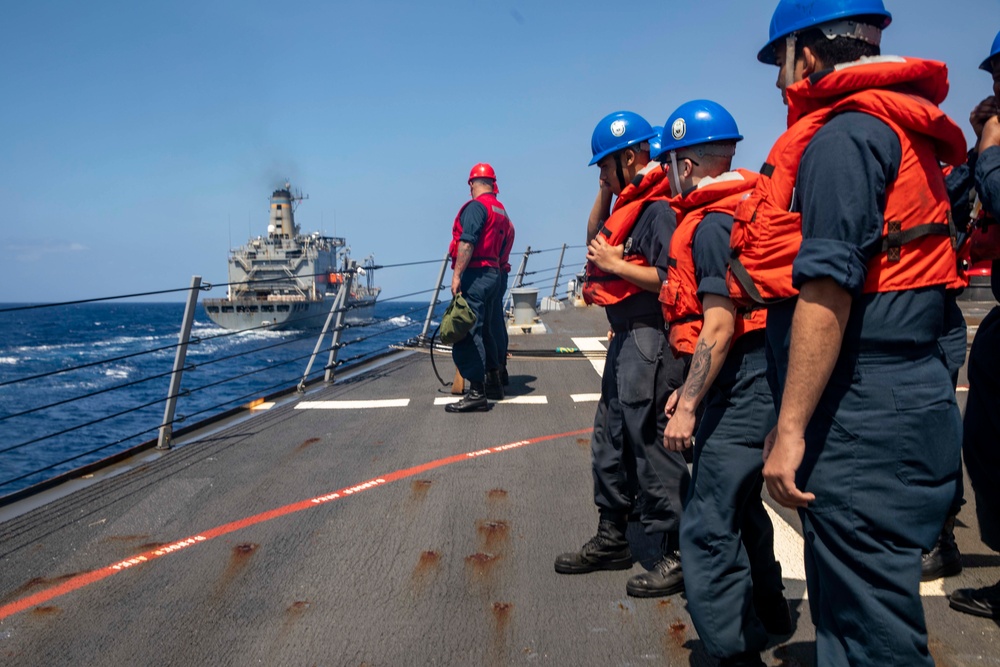 Sailors Aboard USS Ralph Johnson (DDG 114) Conduct Replenishment-at-Sea with USNS Guadalupe (T-AO-200)