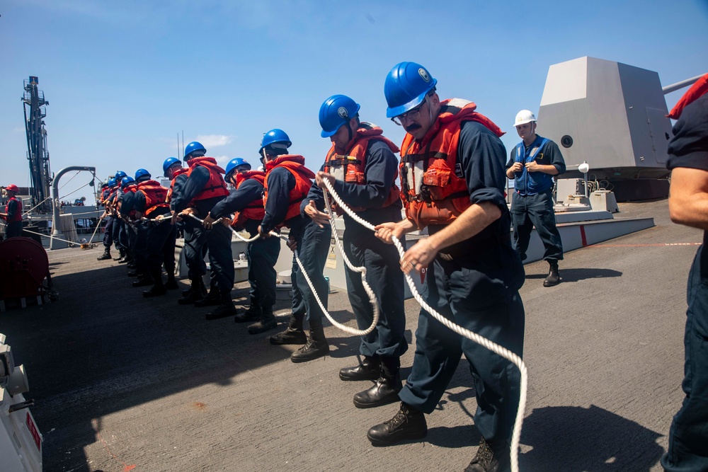 Sailors Aboard USS Ralph Johnson (DDG 114) Conduct Replenishment-at-Sea with USNS Guadalupe (T-AO-200)