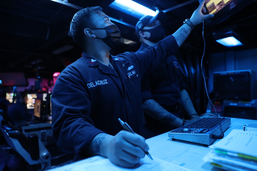 Operations Specialist First Class Peterjohn Delacruz serves as Combat Information Center Watch Supervisor onboard Arleigh-Burke class guided-missile destroyer USS Barry (DDG 52)