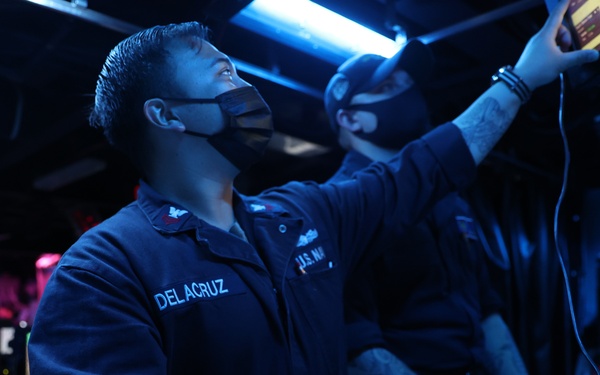 Operations Specialist First Class Peterjohn Delacruz serves as Combat Information Center Watch Supervisor onboard Arleigh-Burke class guided-missile destroyer USS Barry (DDG 52)