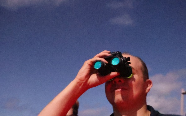 Ensign Murray scans horizon aboard USS Barry