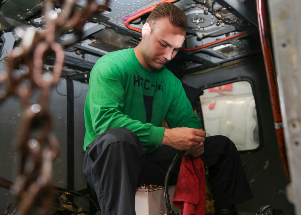 Abraham Lincoln Sailors conduct aircraft maintenance