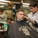 Abraham Lincoln Sailors conduct haircuts