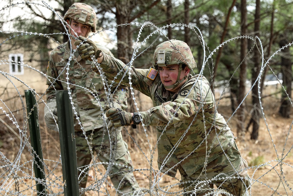 New Jersey Army National Guard Sappers place obstacles