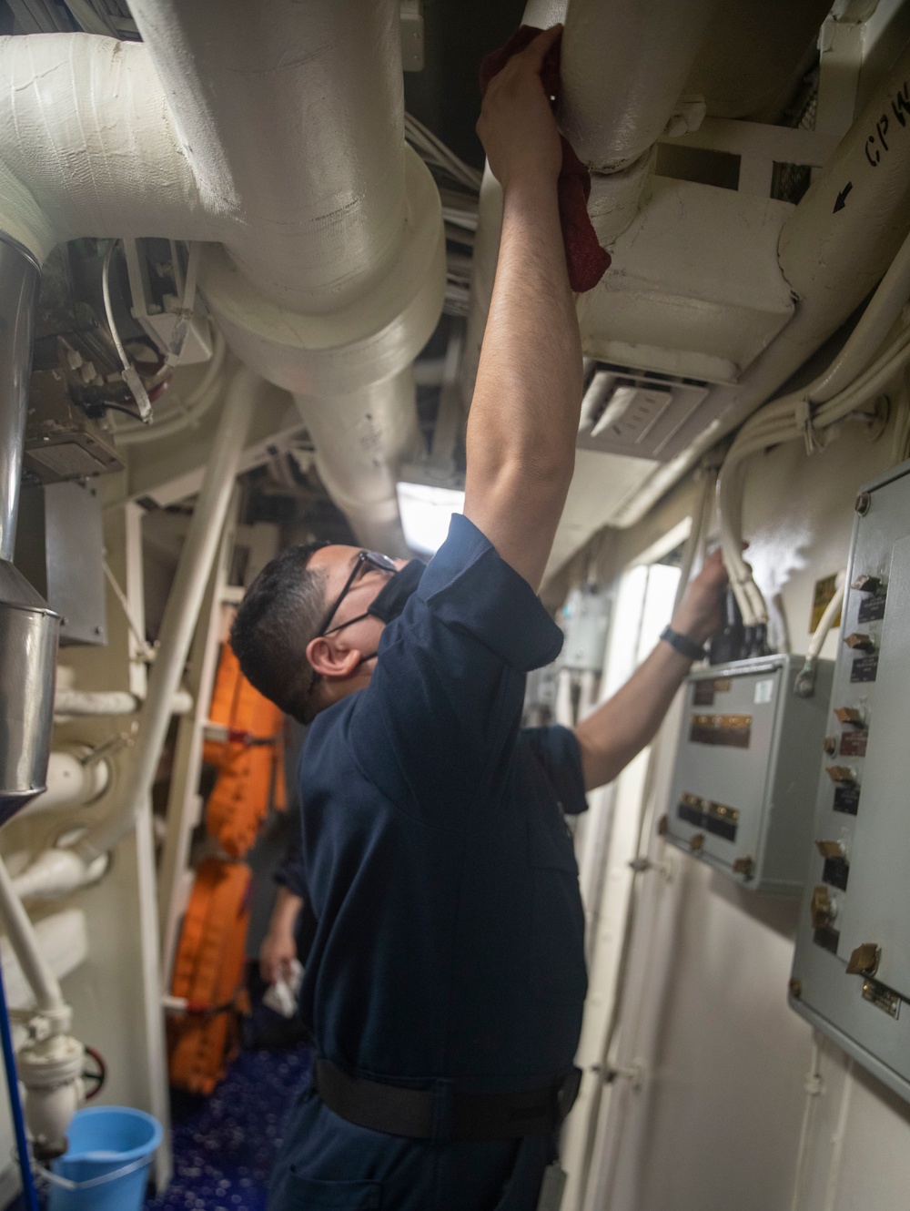 Sailors Aboard USS Ralph Johnson (DDG 114) Conduct Daily Sanitization