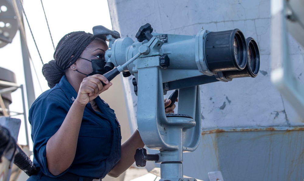 USS Barry Sailor scans horizon for surface contacts