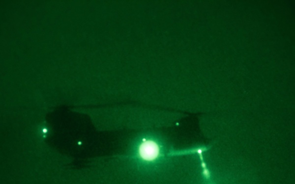 CH-47 Chinook Drops off Equipment for Night Sling Load Operation