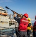 Sailors Aboard USS Ralph Johnson (DDG 114) Conduct Replenishment-at-Sea with USNS Matthew Perry (T-AKE-9)