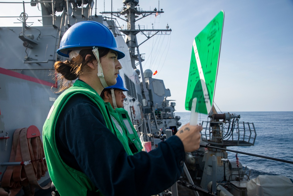 Sailors Aboard USS Ralph Johnson (DDG 114) Conduct Replenishment-at-Sea with USNS Matthew Perry (T-AKE-9)