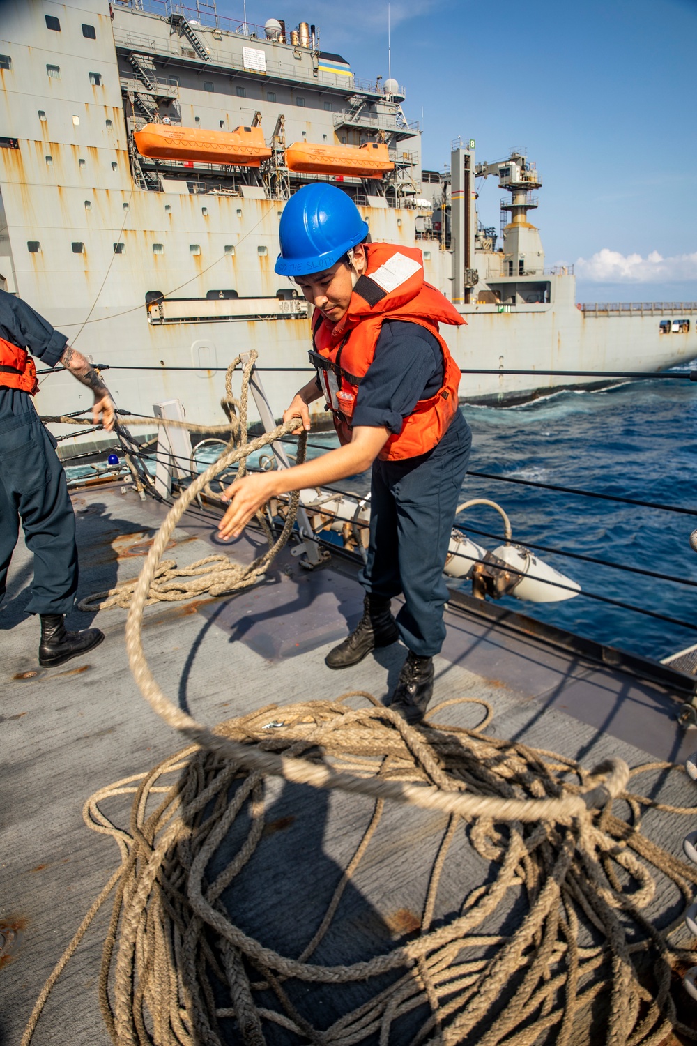 Sailors Aboard USS Ralph Johnson (DDG 114) Conduct Replenishment-at-Sea with USNS Matthew Perry (T-AKE-9)