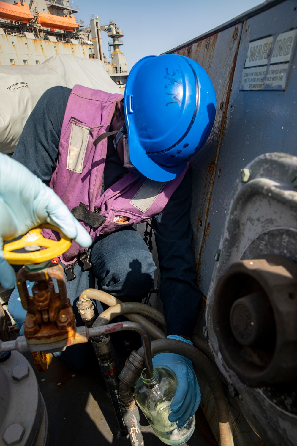 Sailors Aboard USS Ralph Johnson (DDG 114) Conduct Replenishment-at-Sea with USNS Matthew Perry (T-AKE-9)