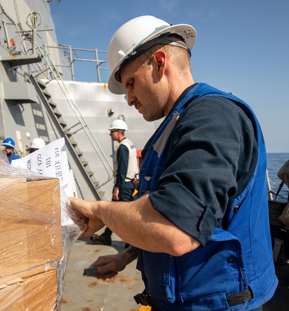 Sailors Aboard USS Ralph Johnson (DDG 114) Conduct Replenishment-at-Sea with USNS Matthew Perry (T-AKE-9)