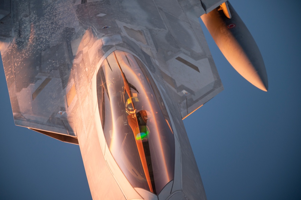 340th EARS refuels F-22s at sunset