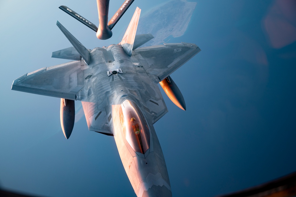 340th EARS refuels F-22s at sunset