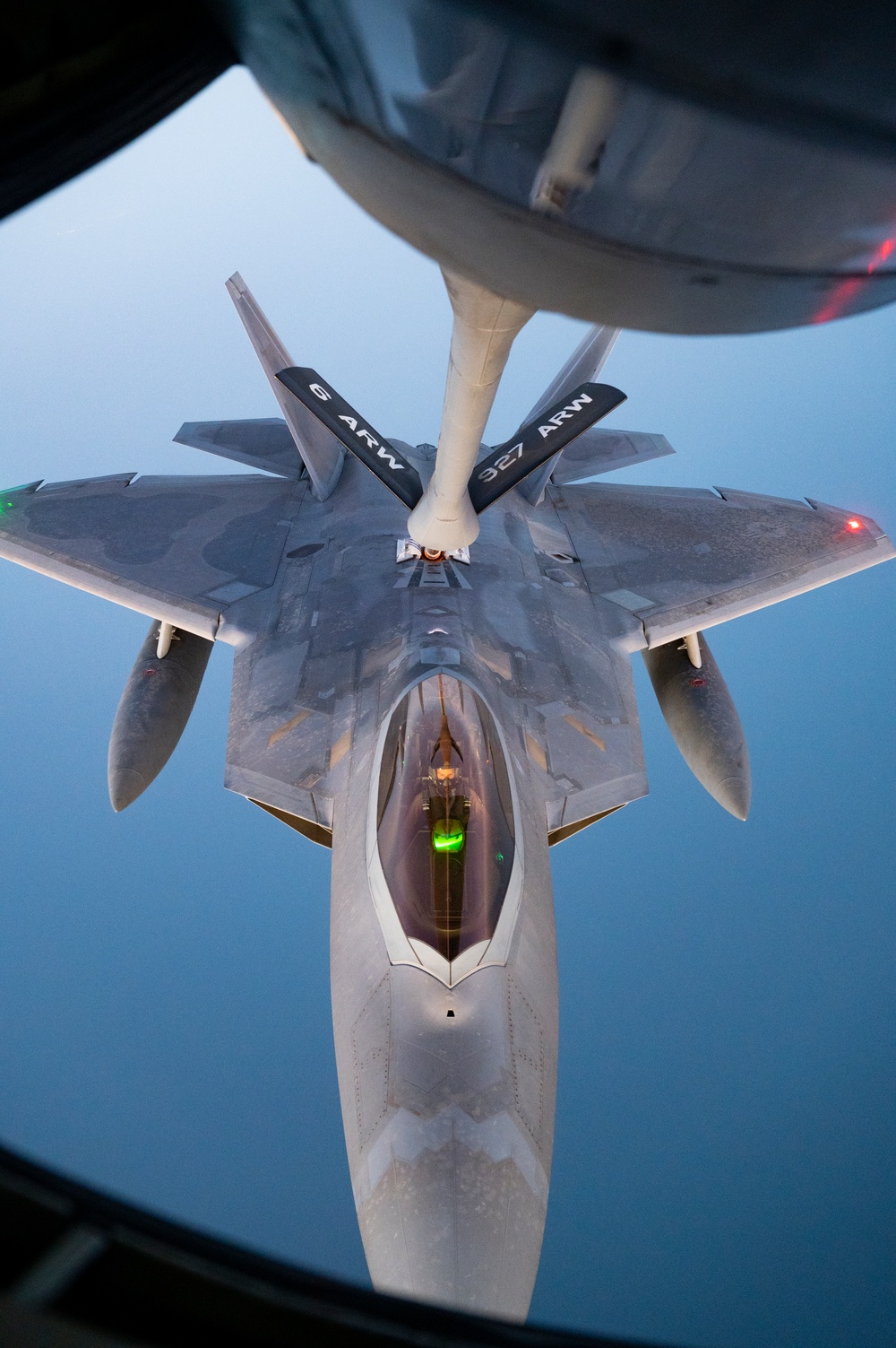 340th EARS refuels F-22s at sunset