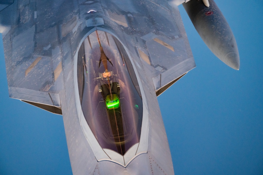 340th EARS refuels F-22s at sunset
