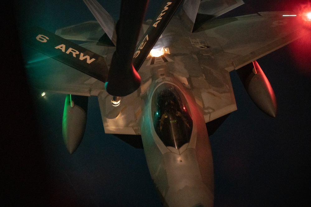 340th EARS refuels F-22s at sunset