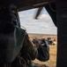 A U.S. Army Soldier from Alpha Company 2nd Battalion, 227th Aviation Regiment, 1st Air Cavalry fires an M240H from a UH-60 Blackhawk at Grafenwoehr Training Area, Germany on March 16, 2022