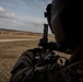 A U.S. Army soldier assigned to Alpha Company 2nd Battalion 227th Aviation Regiment, 1st Air Cavalry loads an M240H at Grafenwoehr Training Area, Germany on March 16, 2022