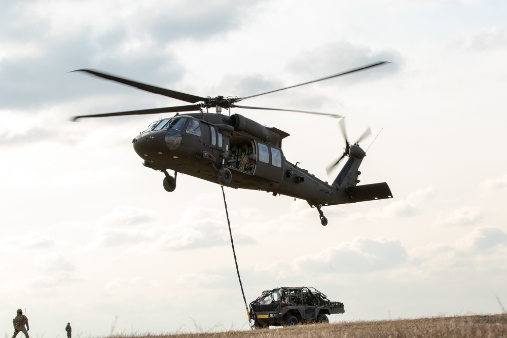 3rd Battalion, 227th Aviation Regiment conducts sling load and air assault operations with the Royal Netherlands 11th Infantry Brigade during Rapid Falcon 2022