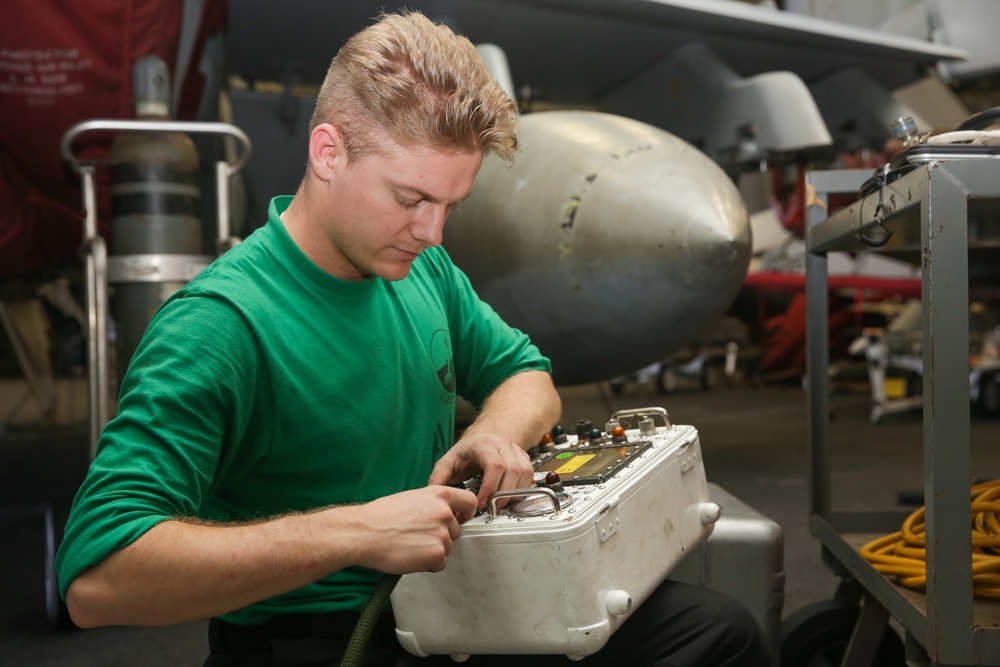 Abraham Lincoln Sailors conduct aircraft maintenance