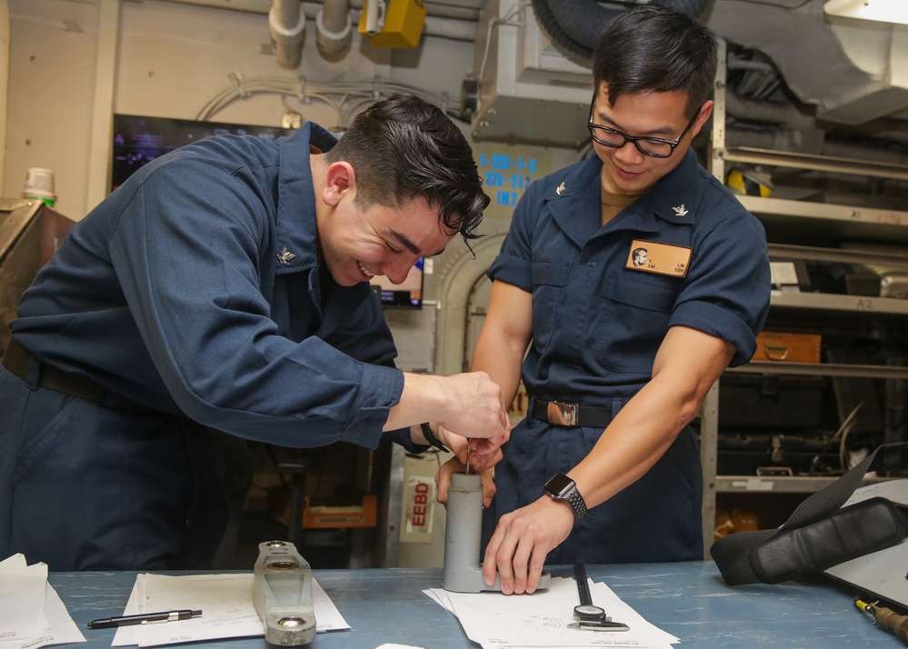 Abraham Lincoln Sailors conduct maintenance