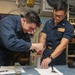 Abraham Lincoln Sailors conduct maintenance