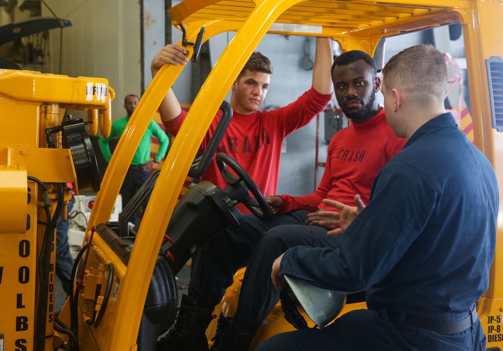 Abraham Lincoln Sailors participate in forklift training