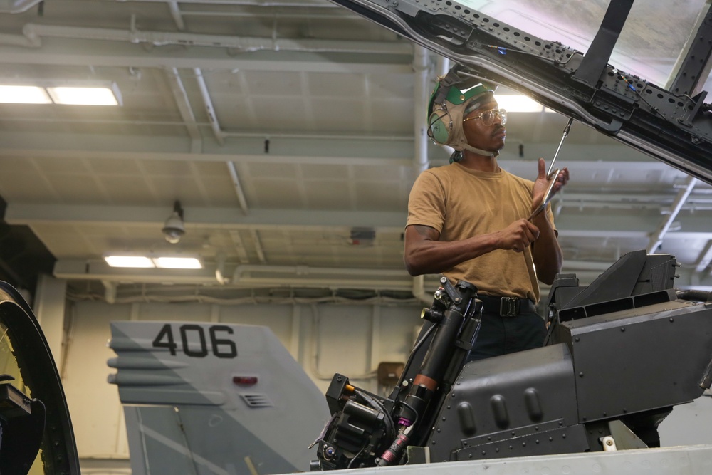 Abraham Lincoln Sailors conduct aircraft maintenance