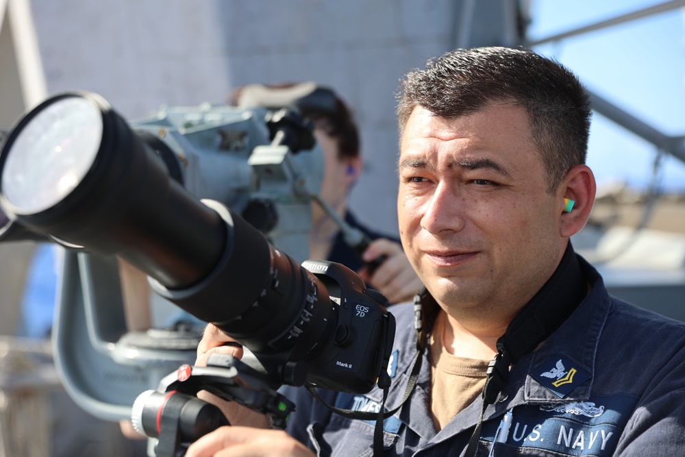 USS Barry Sailor spots targets during gunnery exercise